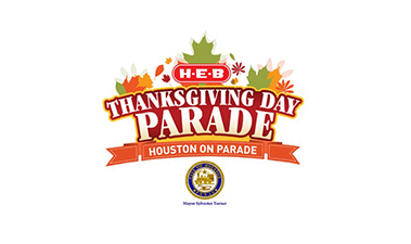 logo for the h-e-b thanksgiving day parade. the design features colorful autumn leaves around the text, with a ribbon below stating "houston on parade" and the city of houston emblem.