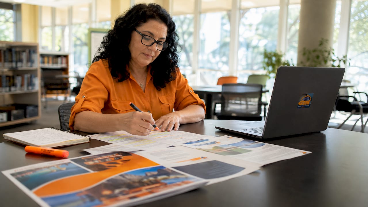 educator reviewing student travel insurance policies