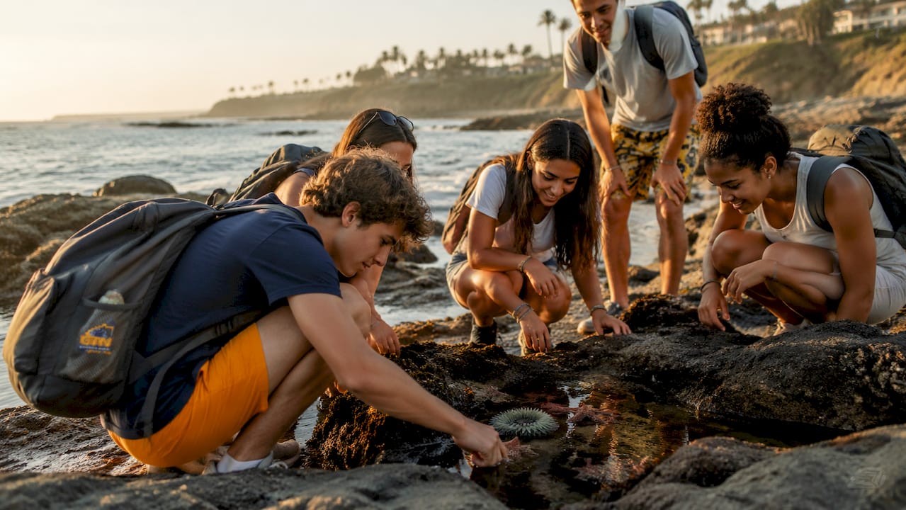 high school students walking on sunny beach vacation