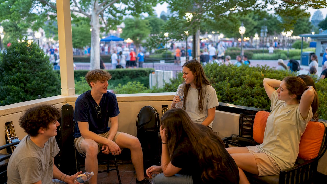 students resting outdoors on downtime
