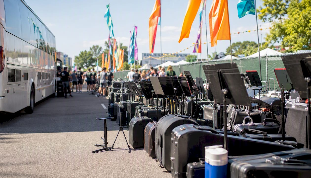 bowl game band trip planning: a 2026 guide for directors 5 staging area with band equipment neatly arranged