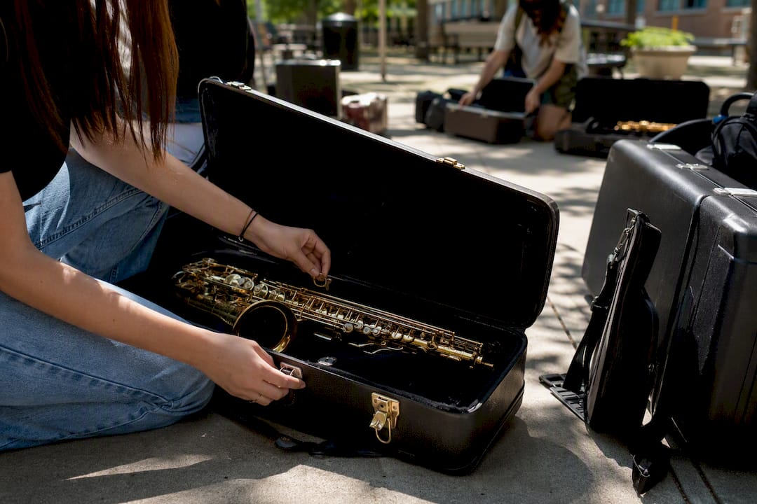 orchestra tour planning for music educators: a step-by-step path 4 students packing musical instruments carefully