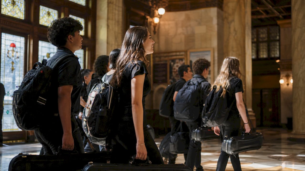 students entering chicago theater lobby
