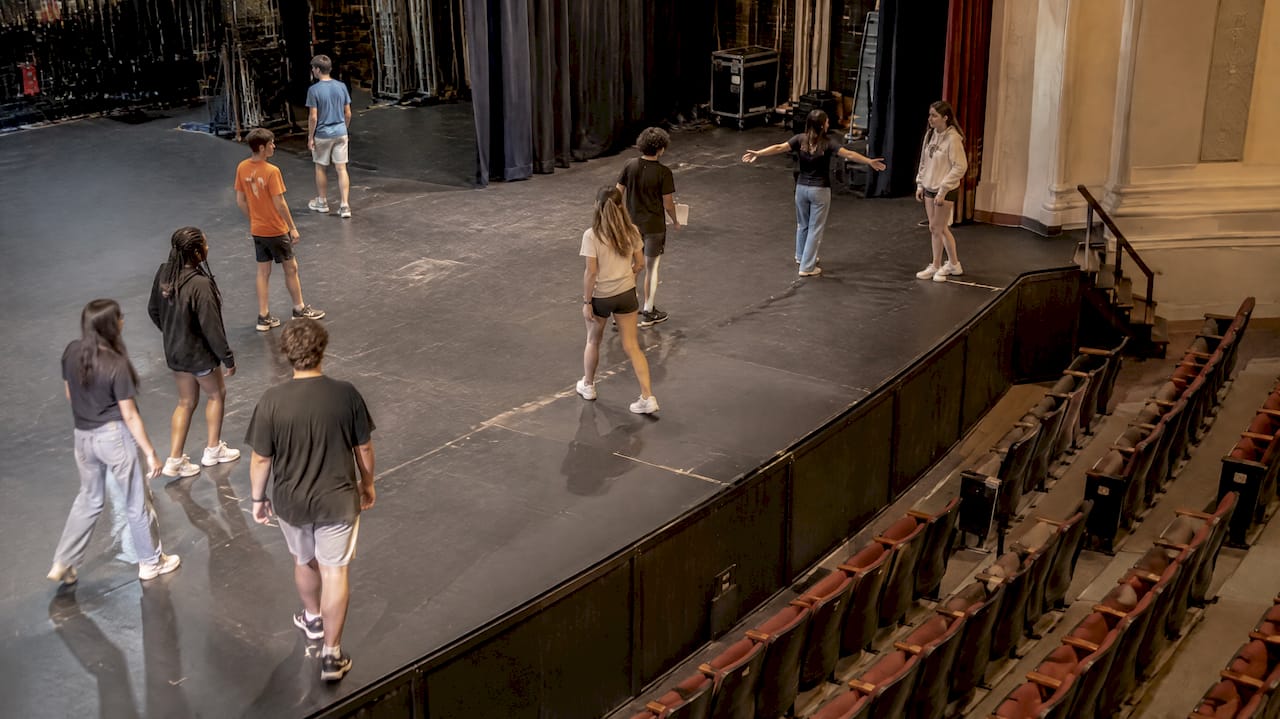 New Orleans Performance Venues for School Planners: 50–17,500 Seats 2 Students testing a performance stage layout