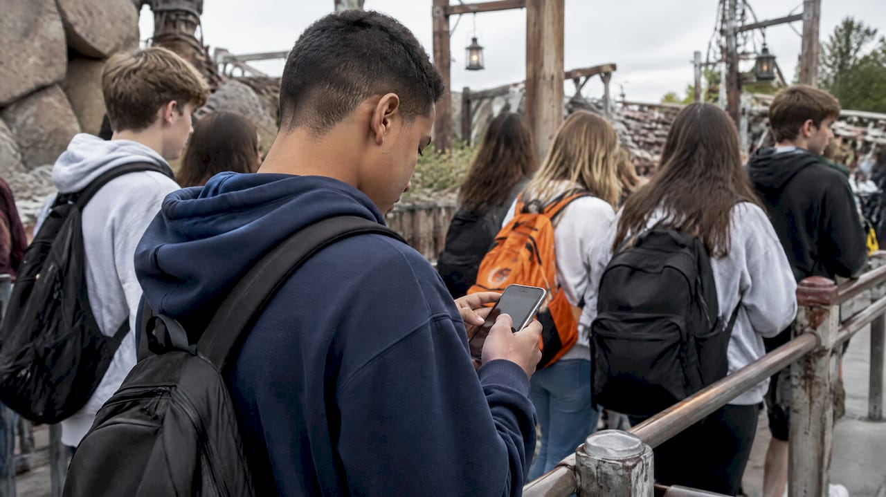 Cut Costs and Comply: Online vs Paper Forms for School Organizers 1 Students answer a trip survey at a theme park